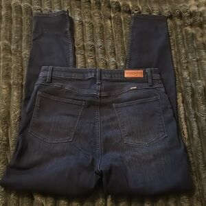Super dark wash, high-rise Wrangler skinny jeans size 12